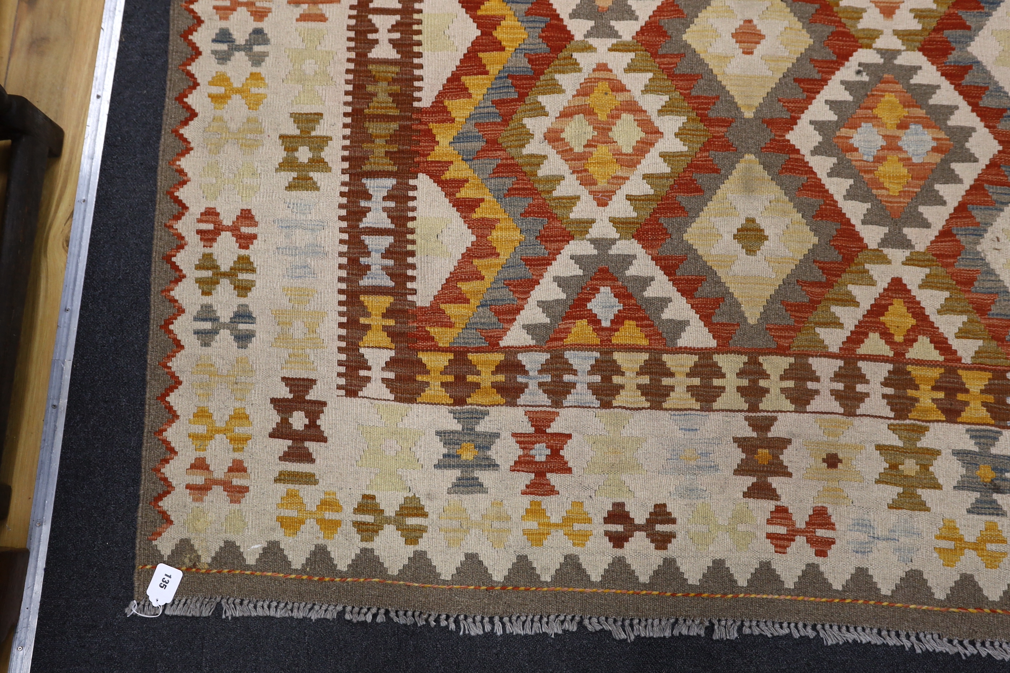 A Kilim polychrome geometric carpet, 250 x 177cm